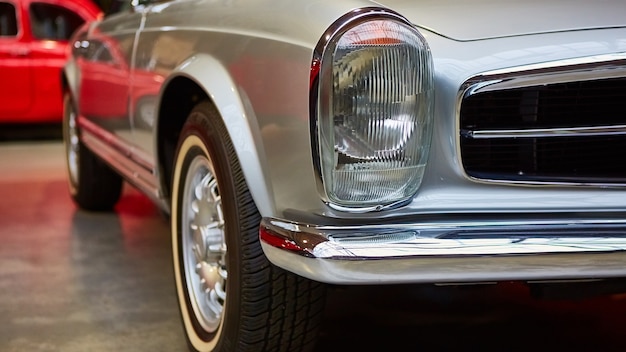 Detail of classic car. Closeup of headlight.