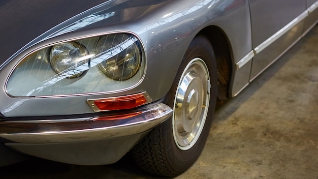 Detail of classic car. Closeup of headlight.