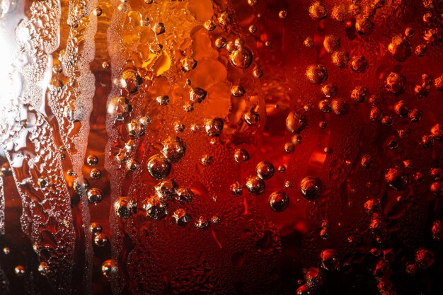 Photo detail of cold bubbly carbonated soft drink with ice