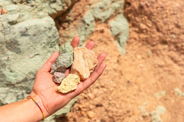 Photo detail of the colors of the stones in the natural monument azulejos de veneguera or rainbow rocks in mogan gran canaria