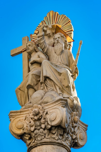 Detail of column with statue of Abraham and Isaac in front of Roman Catholic church Saint Charles Borromeo in Pancevo, Serbia