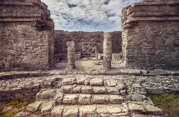 Detail of the columns of a Mayan temple of the tulum complex in mexico.