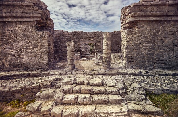 Detail of the columns of a Mayan temple of the tulum complex in mexico.