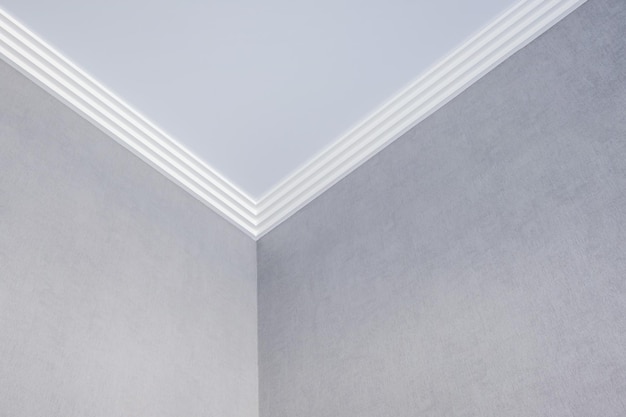 Detail of corner ceiling cornice with intricate crown\
molding