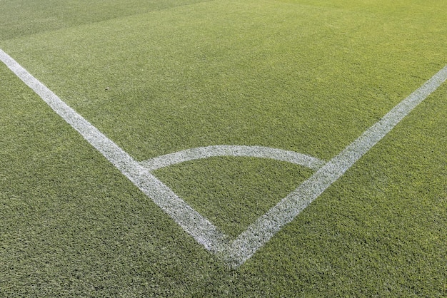 Detail of the corner of a natural grass soccer field Concept of soccer competition football victory cup win and lose