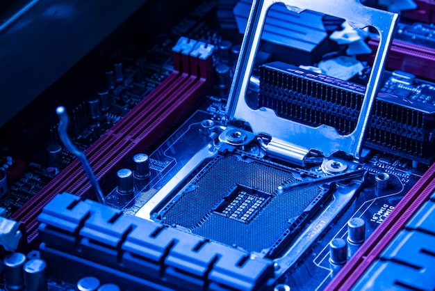 Detail of a Cpu socket in a motherboard of a gaming pc in bluie light