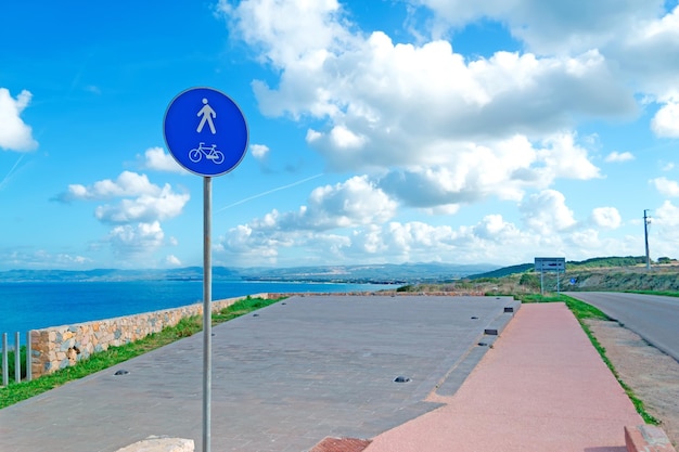 Detail of a cycle path signal by the coastline