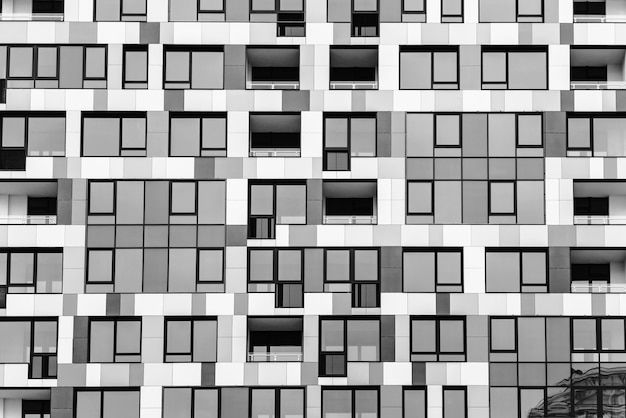 Detail of the facade of a multistory building. Building, unusual facade of multistoried building