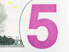 Detail of five us dollar banknote