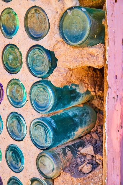 Detail of glass bottle house by window in ghost town
