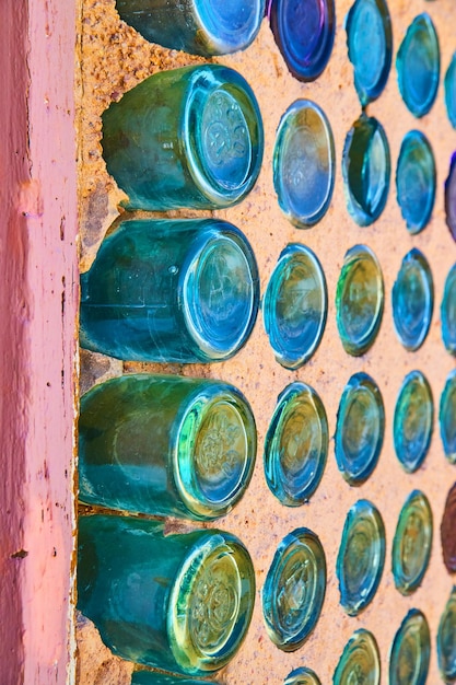 Detail of glass bottles making up wall of house in desert