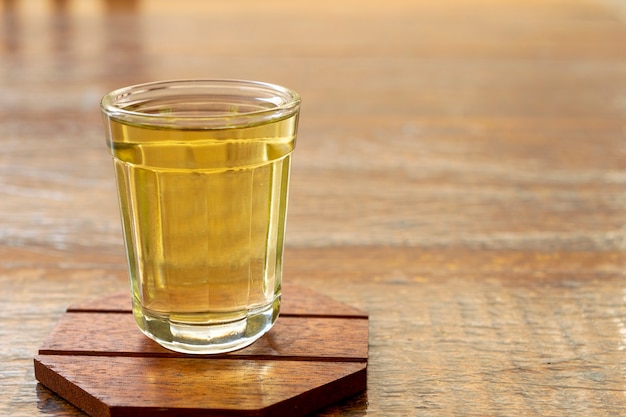 Detail of a glass of cachaÃ§a, a typical Brazilian drink.