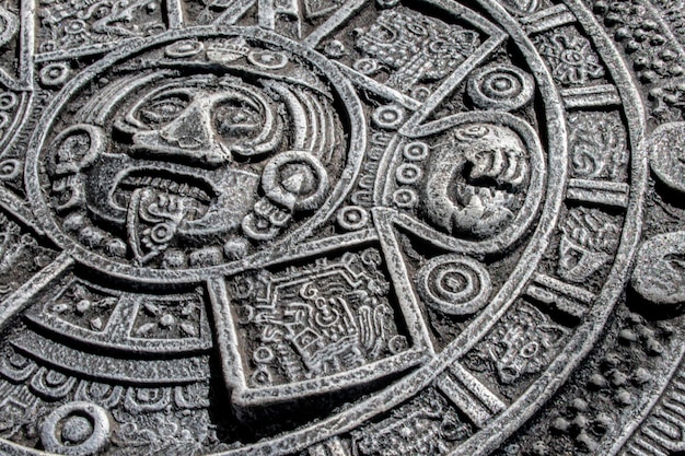 Photo detail of handcarved aztec calendar craftsmanship on stone