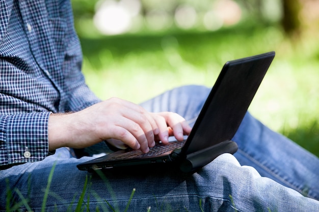 Detail of hands and laptop keyboard