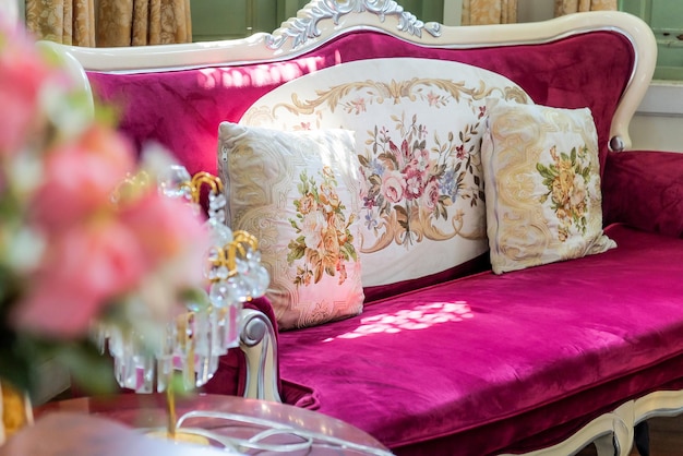 Photo detail image of pillows on an antique luxury sofa interior design and decoration