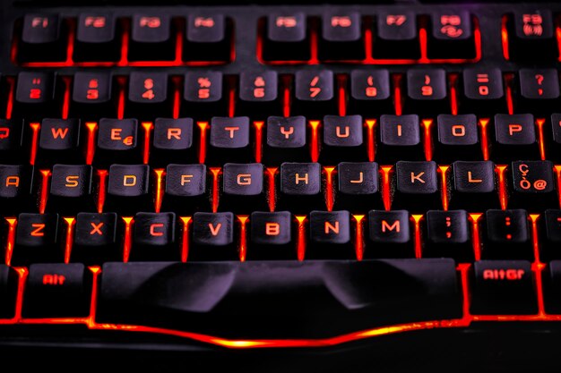 Detail of the keys of a backlit qwerty keyboard for gaming computers