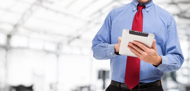 Detail of a man using a tablet computer, large bright opy-space