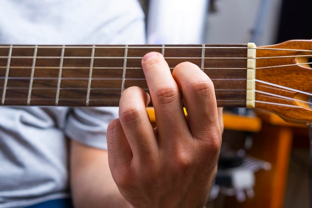 Detail of a man39s hands playing the guitar