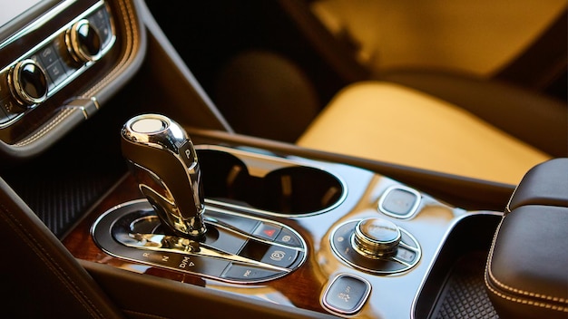 Detail of modern car interior, gear stick, automatic transmission in expensive car.