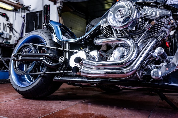 Detail on a modern motorcycle in the workshope. Motorcycle Exhaust.