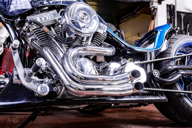 Photo detail on a modern motorcycle in the workshope. motorcycle exhaust.