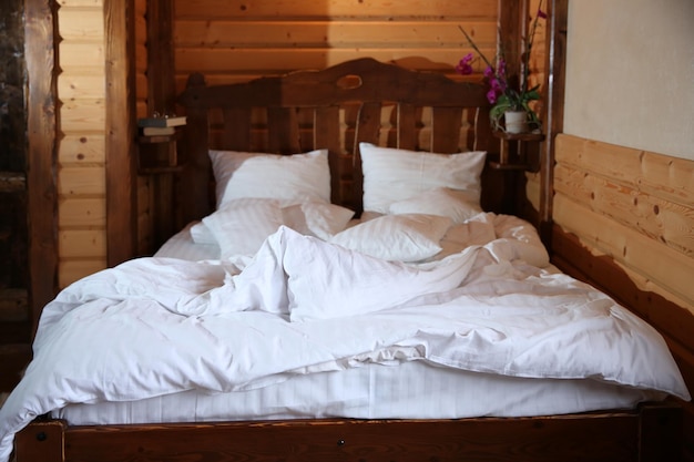 Detail of mountain wooden lodge bedroom