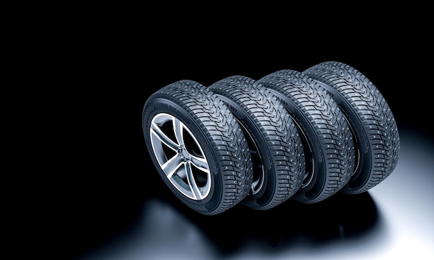 Detail of new snow tires on a dark background. 3d render