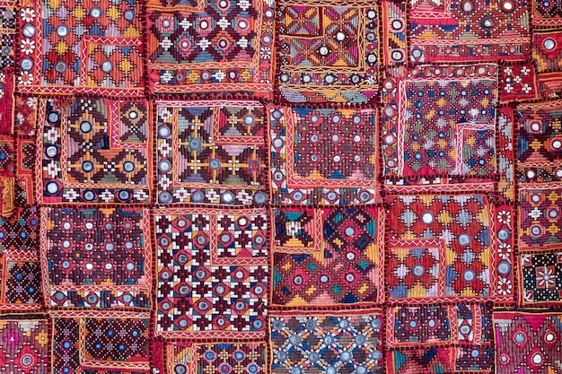 Detail old colorful patchwork carpet in India