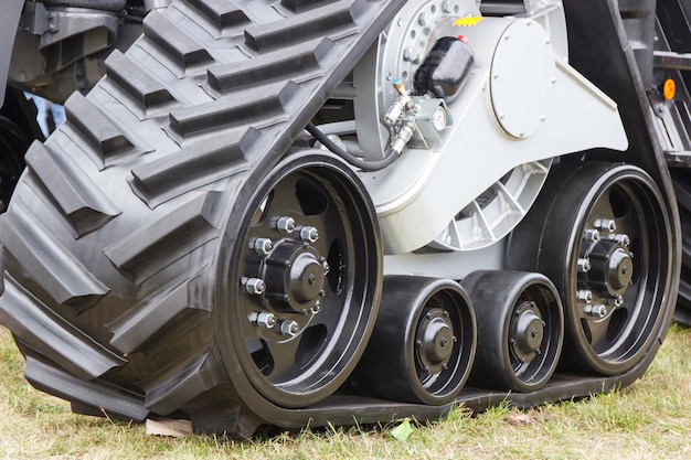 Photo detail and part of metal wheel with caterpillar transportation