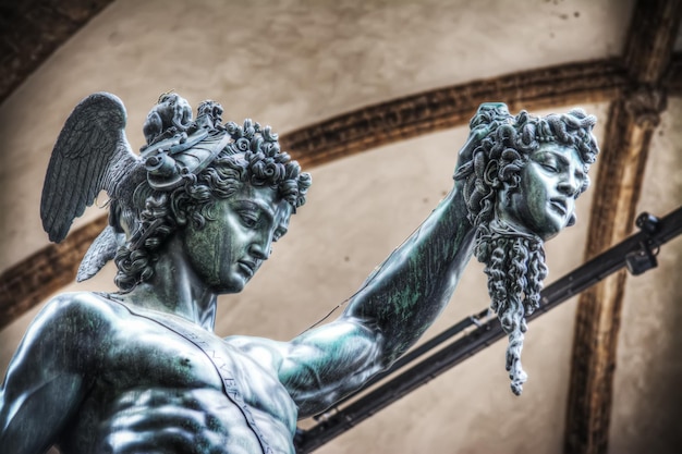 Detail of Perseo holding Medusa head statue in Loggia de Lanzi Florence