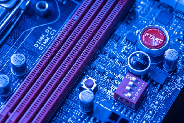 Detail of Ram memory dimm in a motherboard inside a pc in a blue light