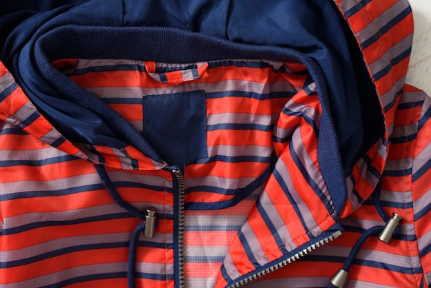 Detail of a red and blue raincoat. Close-up