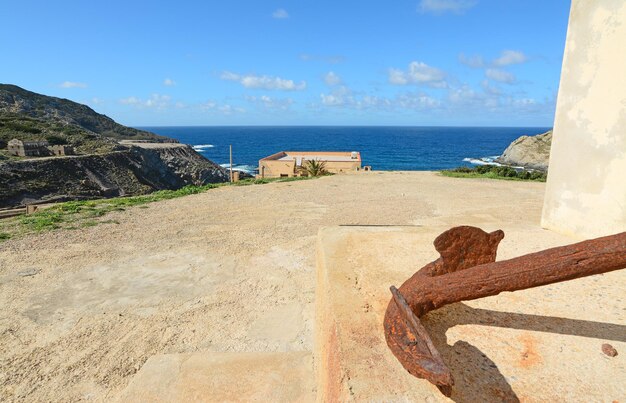 Detail of a rusty anchor in Argentiera coastline