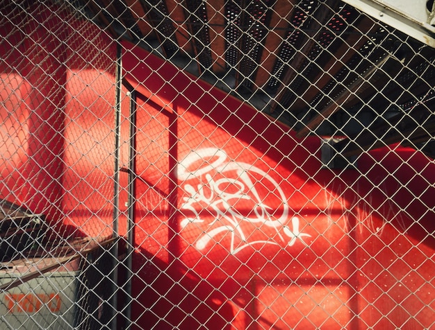 detail shot of fence against red wall