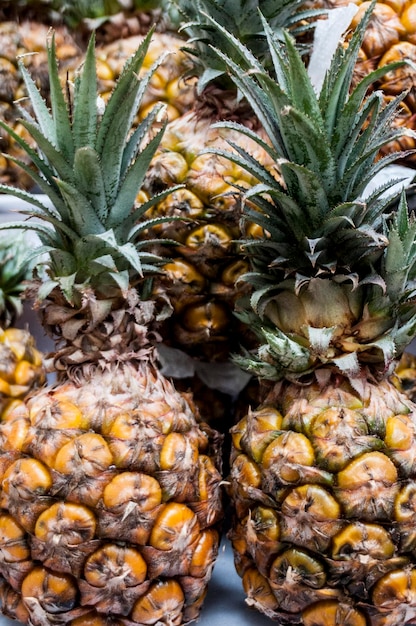 Photo detail shot of pineapples for sale