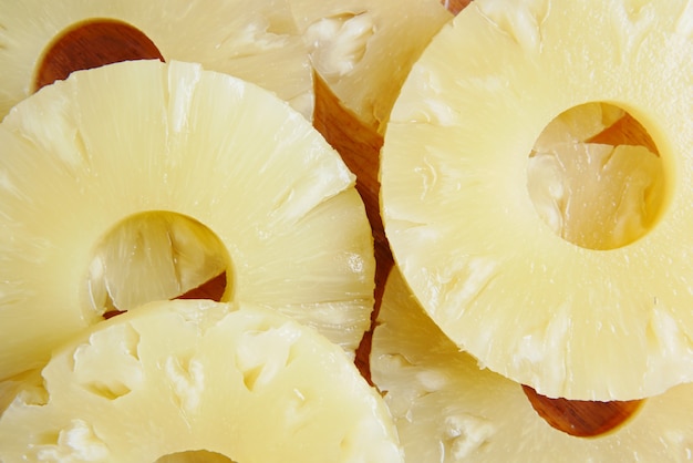 Detail shot of slice of pineapple on table