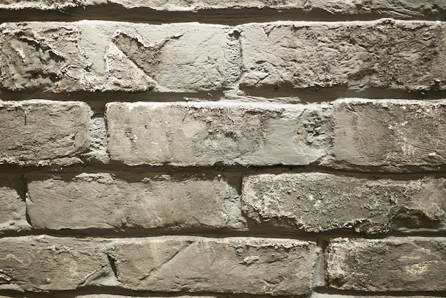 Detail show of old gray brick wall