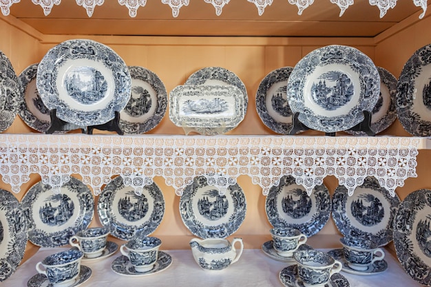 detail showcase with old plates and cups