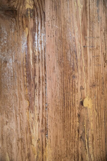 Photo detail of the texture of an old peeling wooden board