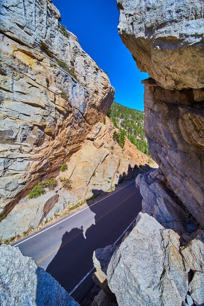 Detail vertical of road cutting through mountain rock