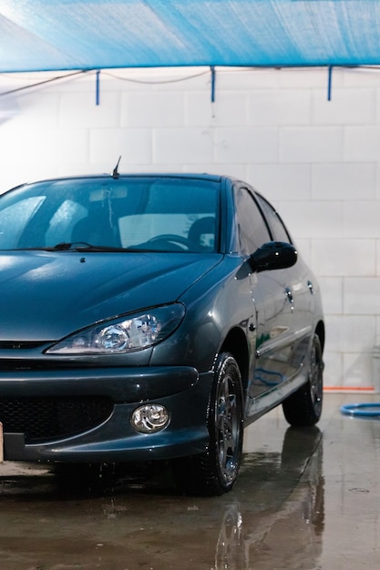 Detail view of a freshly washed car parked at the car wash