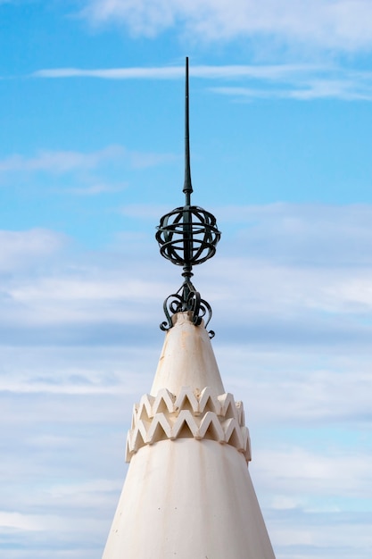 Photo detail view of an iron armillary sphere on top of building