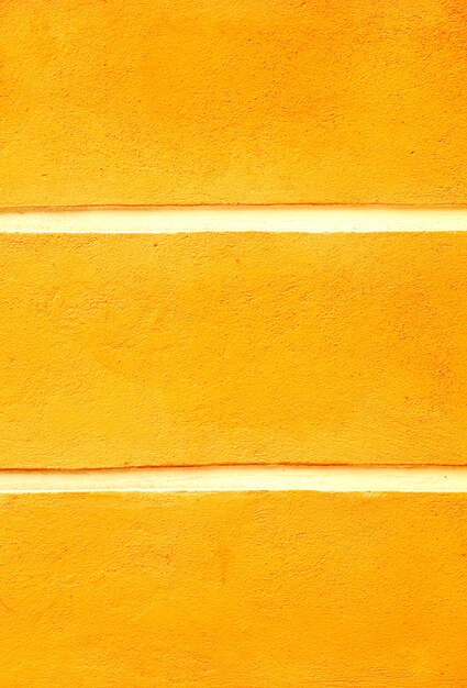 Photo detail of vintage yellow concrete wall background