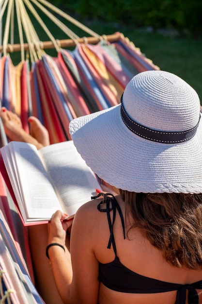 Detail of a woman in a hammockxA