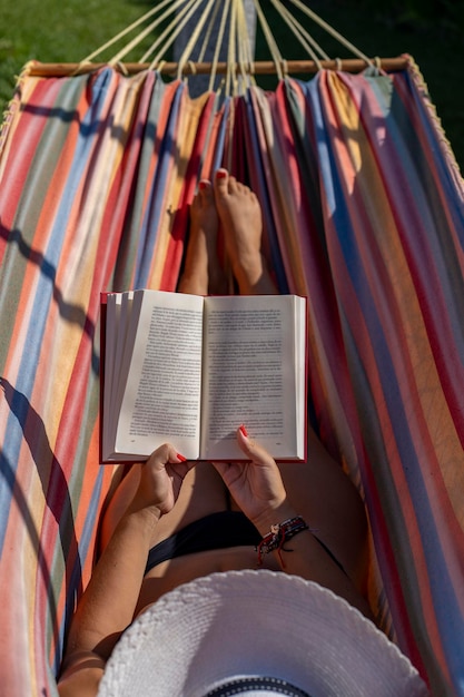 Detail of a woman in a hammockxA