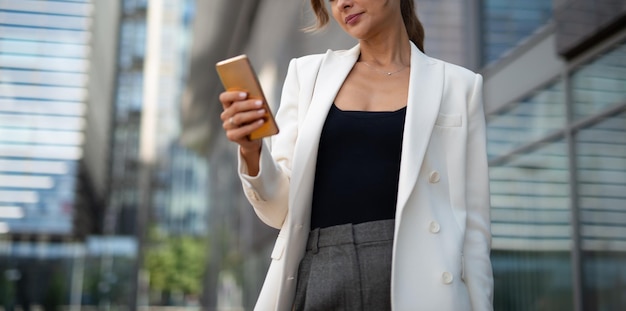 Detail of a woman using her smartphone