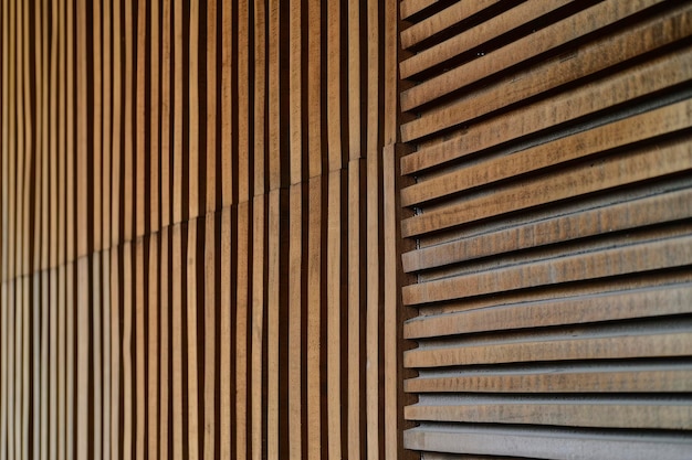 Detail of a wooden wall with a linear relief and texture