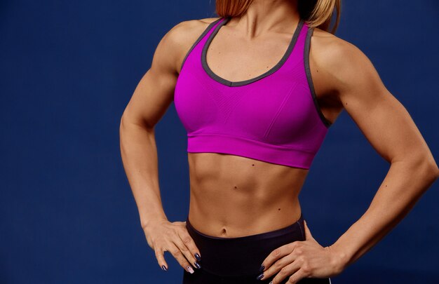 A detail of young sport woman with perfect fitness body