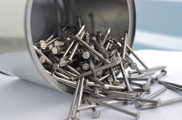 Detailed closeup of several steel nails perfect for illustrating or construction and repair projects Concept that illustrates the diversity of materials used in construction and other professions