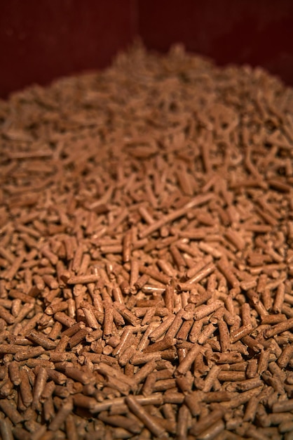 Detailed shot of wood pellets Alternative eco fuel is made from renewable timber wood for the heating house